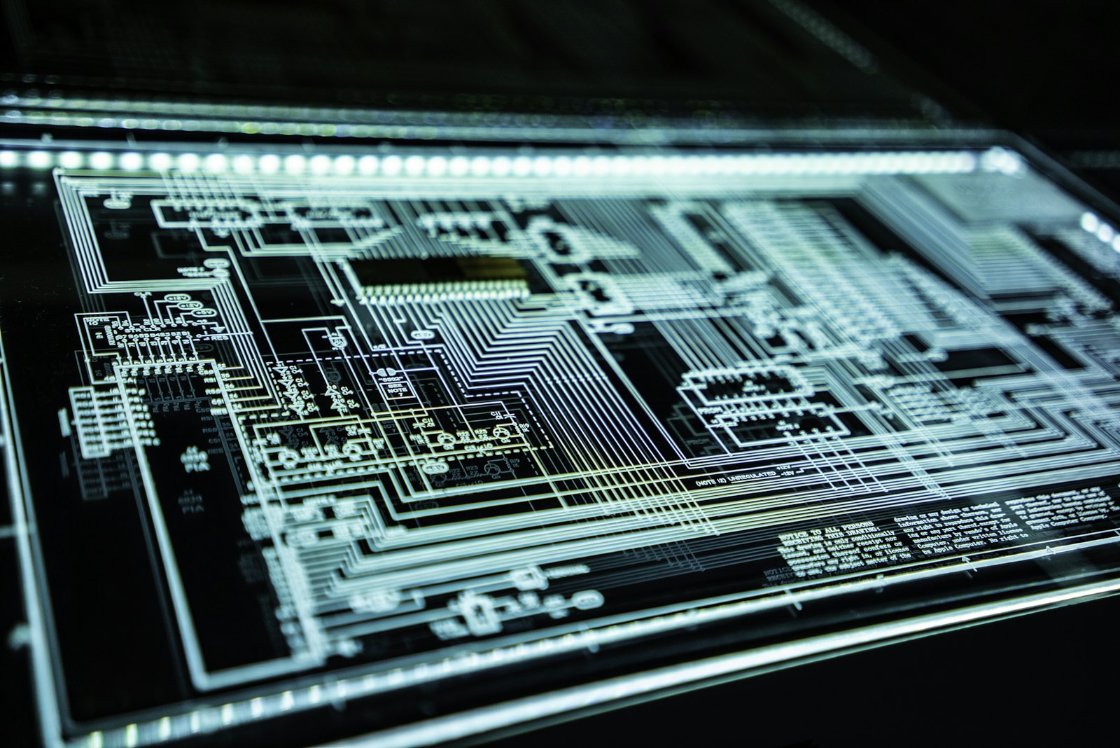 Illuminated circuit schematic representing engineering and cyber capability